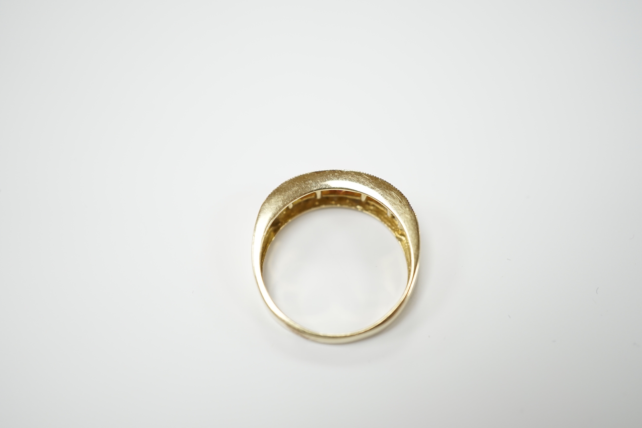 A modern 9ct gold, diamond, and two colour citrine? channel set half hoop ring, size P, gross weight 3.3 grams.